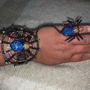 Spider bracelet with ring attached